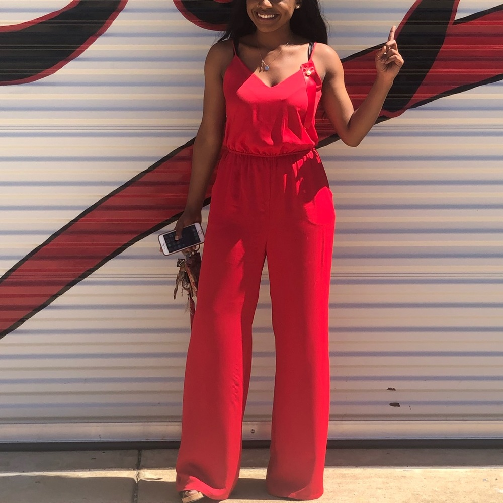 Red jumpsuit w/ pockets & cute open/ cross-cross back